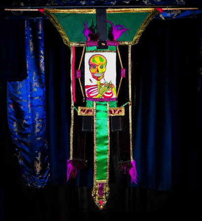 Scull with Emerald Ring and Syringe Watercolor painting 7in by 10in within a tapestry extending it to 2ft 2in by 3ft 8in